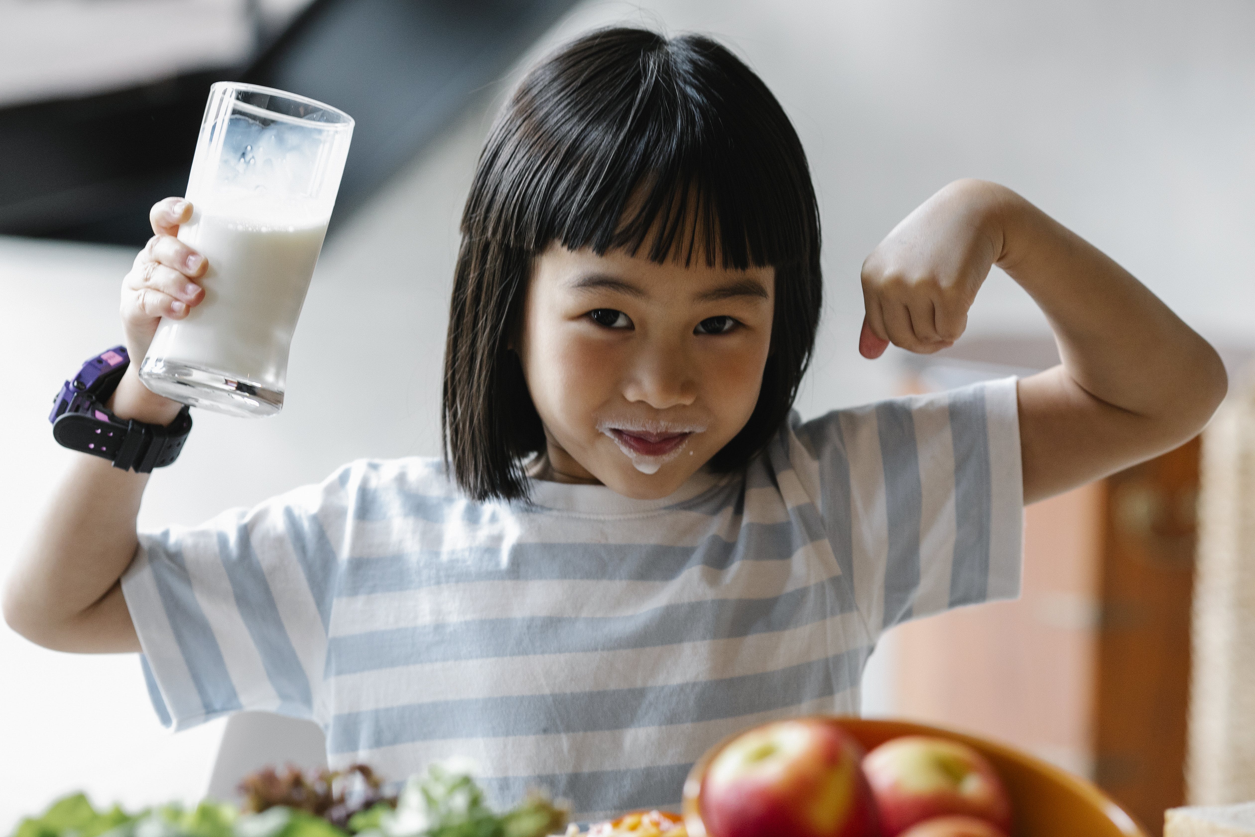 Free Asian girl with milk on lips Stock Photo